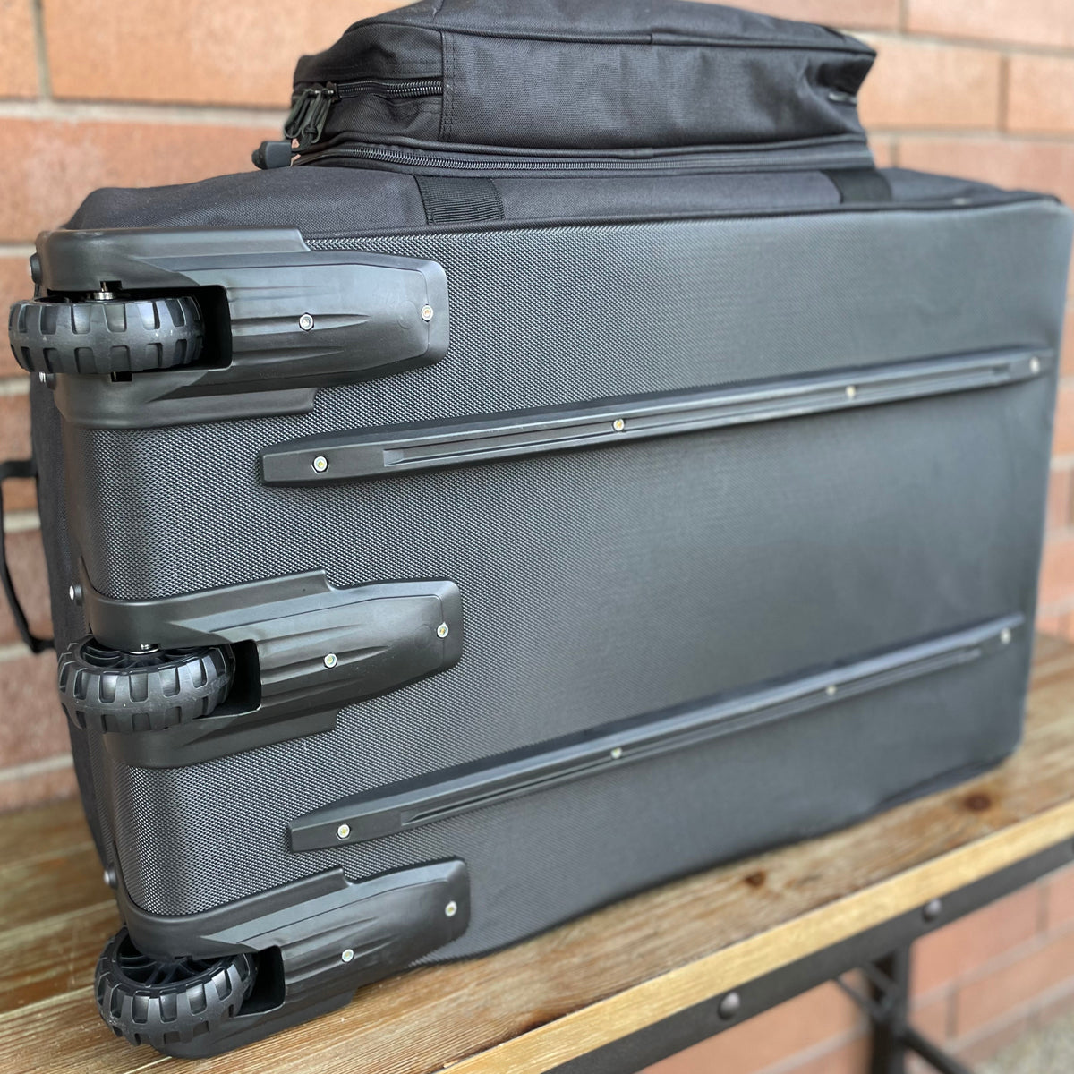 Wolftraders AlphaRoller Wheeled Deployment Luggage Bag Black Wheels and tracks