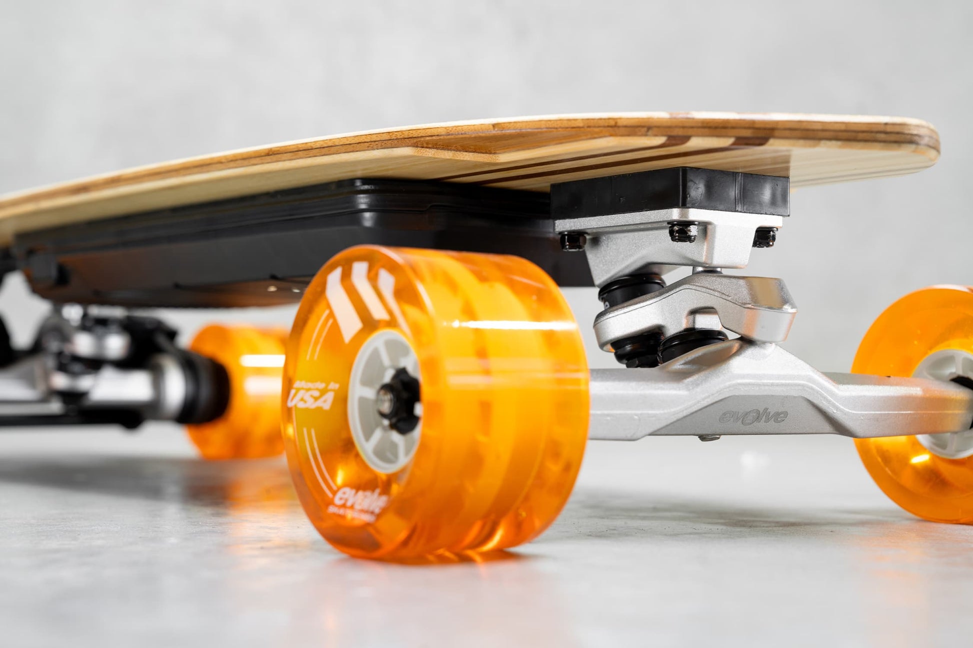 Evolve Skateboards Stoke X Bamboo Cruiser Electric Skateboard Orange Wheels
