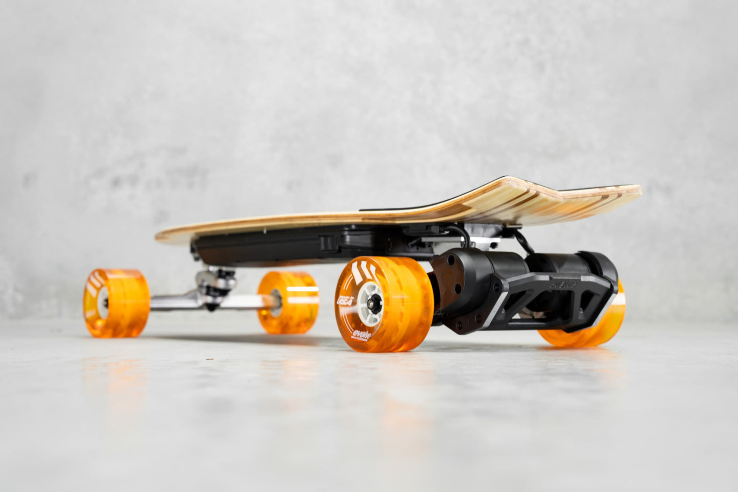 Evolve Skateboards Stoke X Bamboo Cruiser Electric Skateboard Orange Wheels