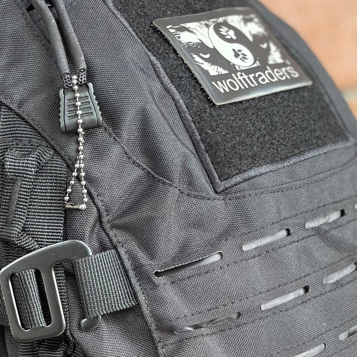 Wolftraders Wolf Mission Tactical Laser cut hydration compatible backpack black molle strap close-up